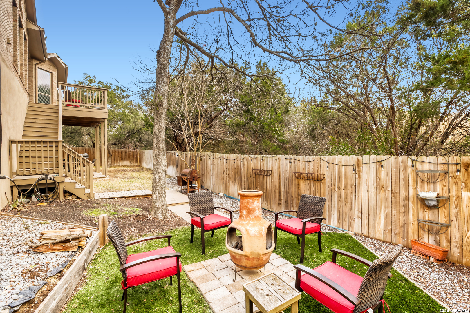 8330 Magdalena Run Helotes, TX 78023 - Photo 23 of 24 a wooden bench sitting in front of a building