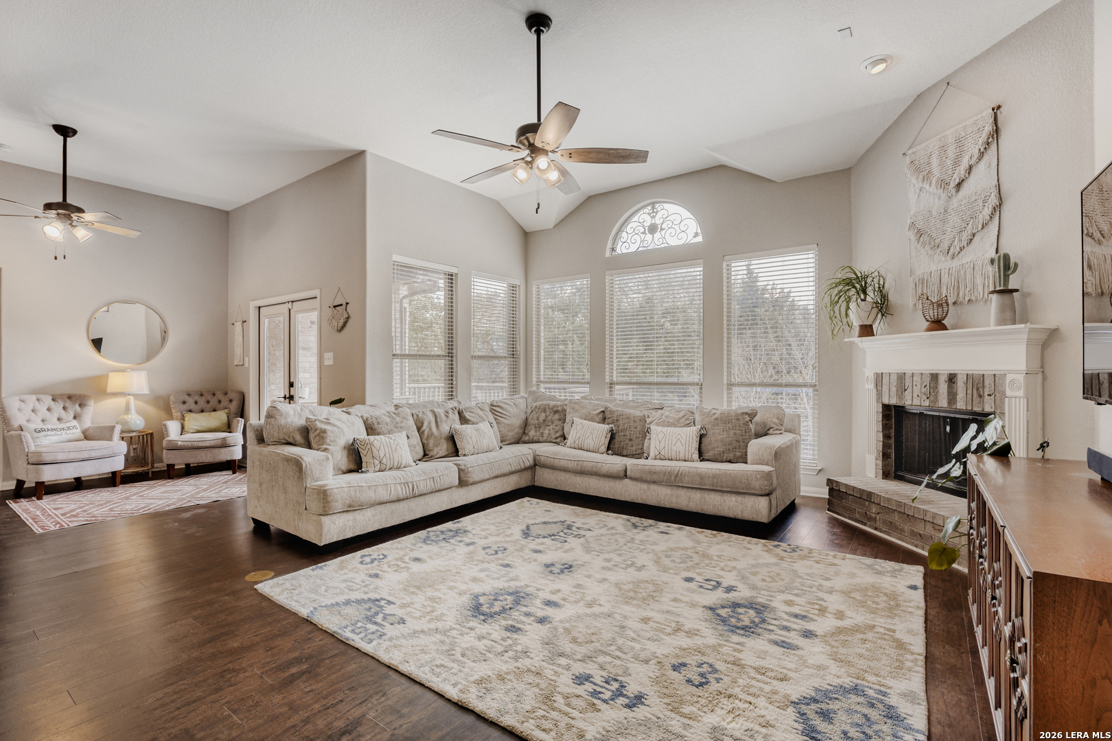 8330 Magdalena Run Helotes, TX 78023 - Photo 3 of 24 a living room with furniture fireplace and a large window