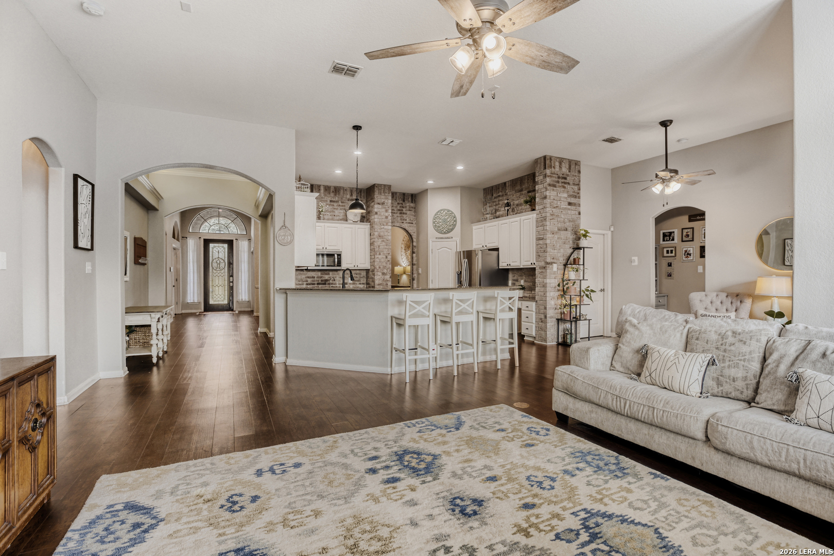 8330 Magdalena Run Helotes, TX 78023 - Photo 5 of 24 a living room with furniture and a chandelier