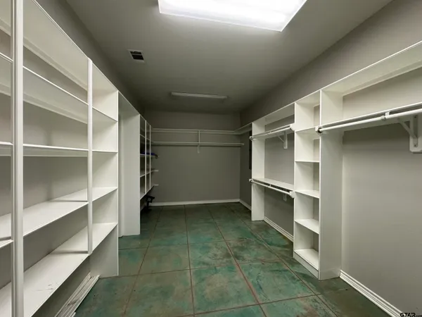a view of an empty walk in closet