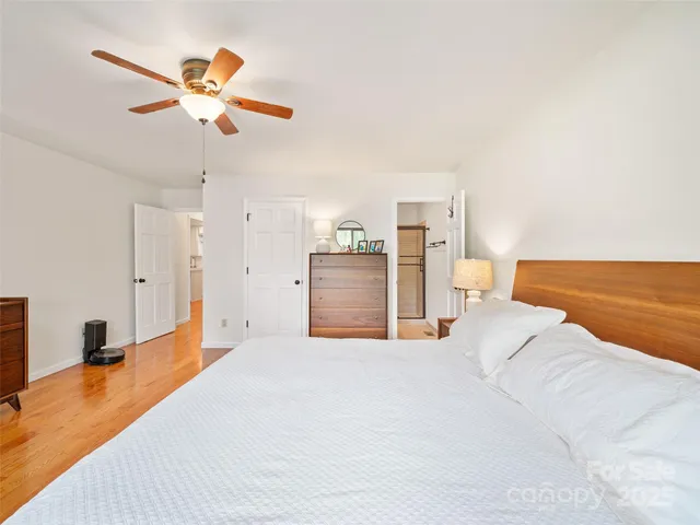 a bed room with a bed and a chandelier