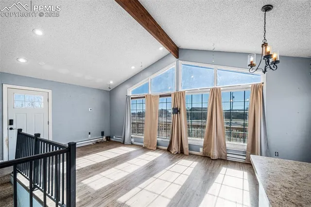 a view of a room with stairs and furniture