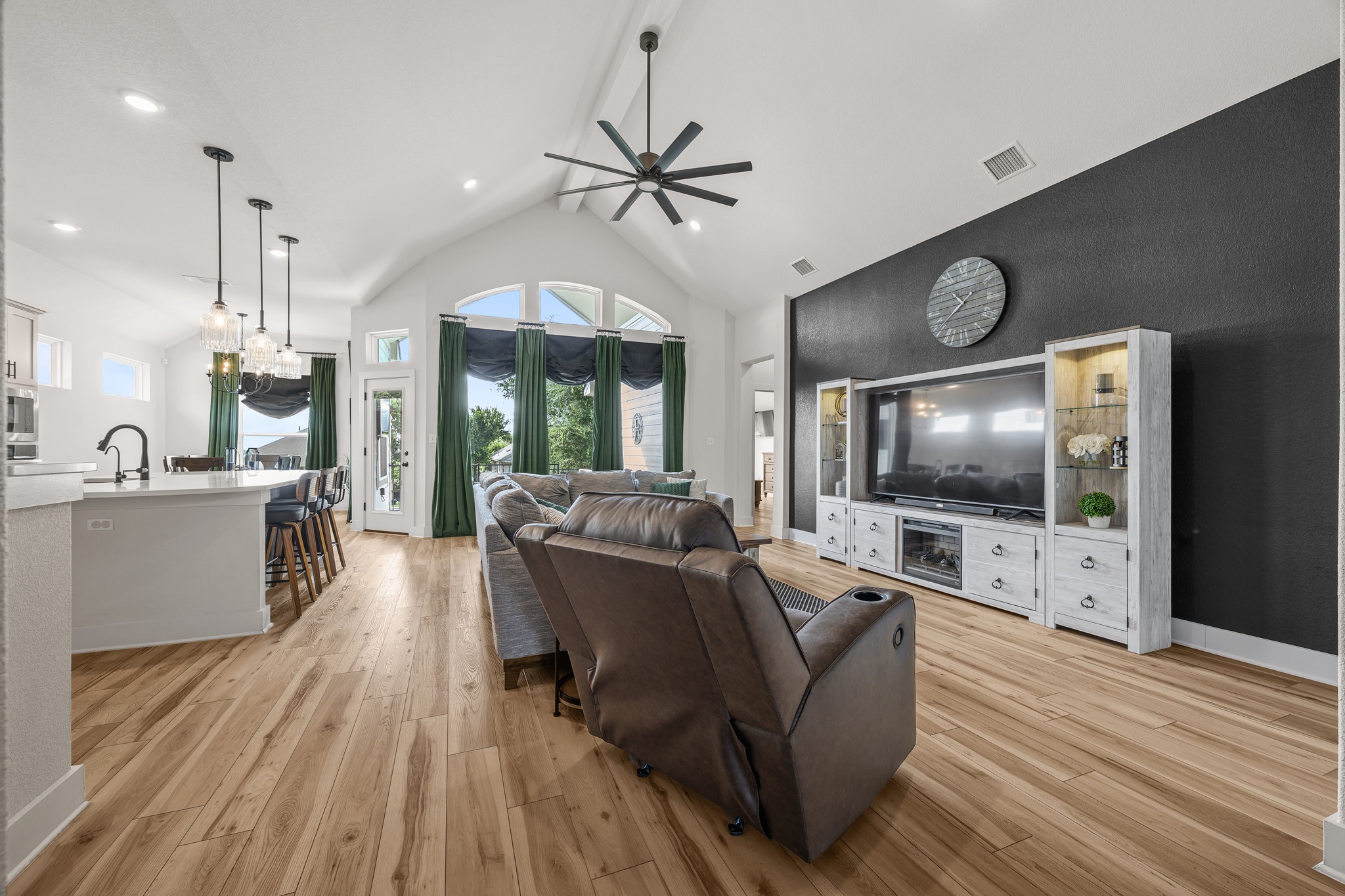 68 Rancho Trail Georgetown, TX 78628 - Photo 8 of 39 Lofty ceilings and a vibrant kitchen island establish this gathering space as the heart of the home.