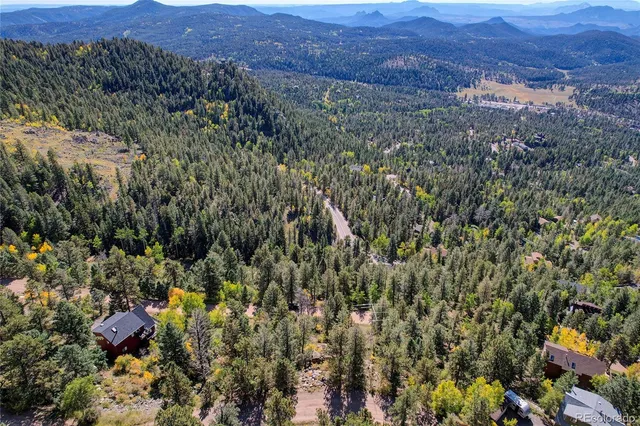 an aerial view of residential house and green space