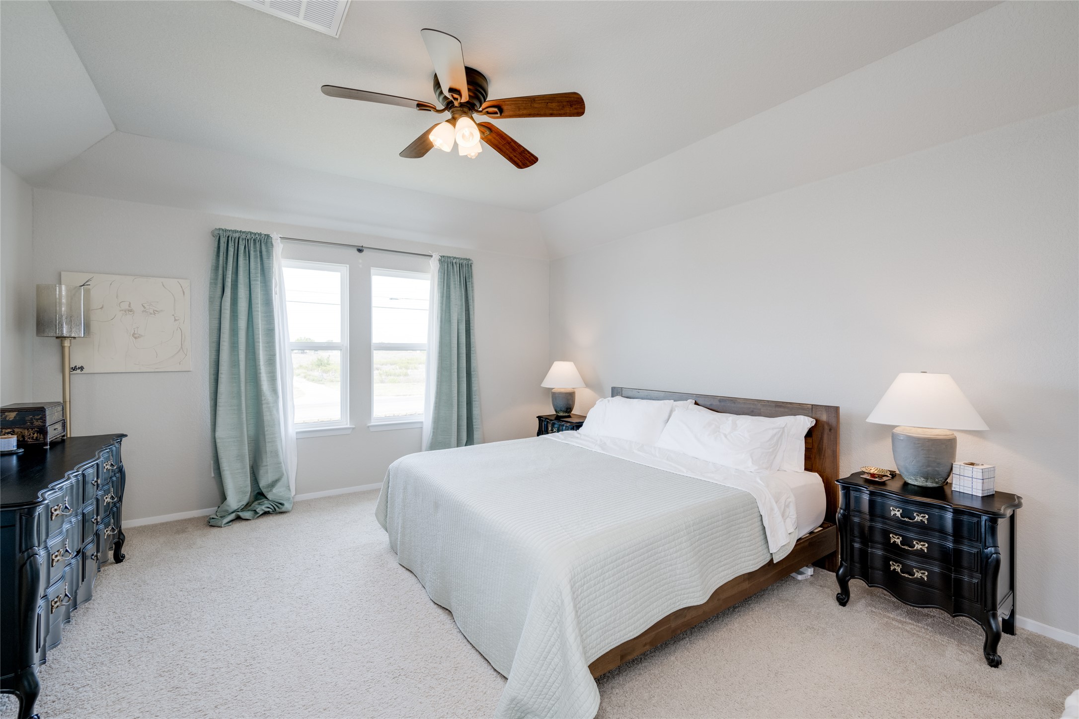 7948 Castelardo Place Round Rock, TX 78665 - Photo 19 of 32 a bedroom with a bed a chandelier and a window