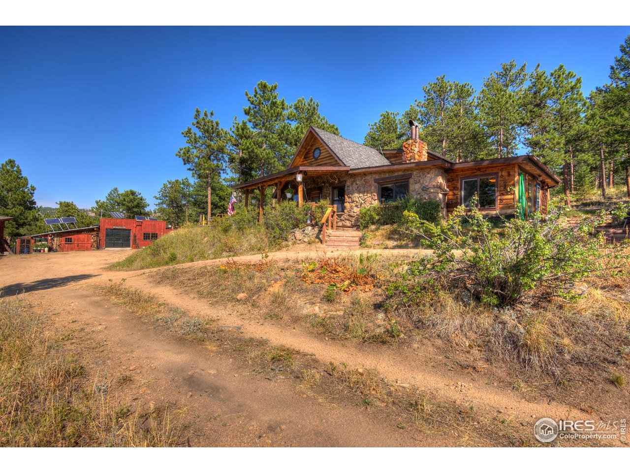900 Spruce Drive Lyons, CO 80540 - Photo 26 of 40 a view of a house with a yard