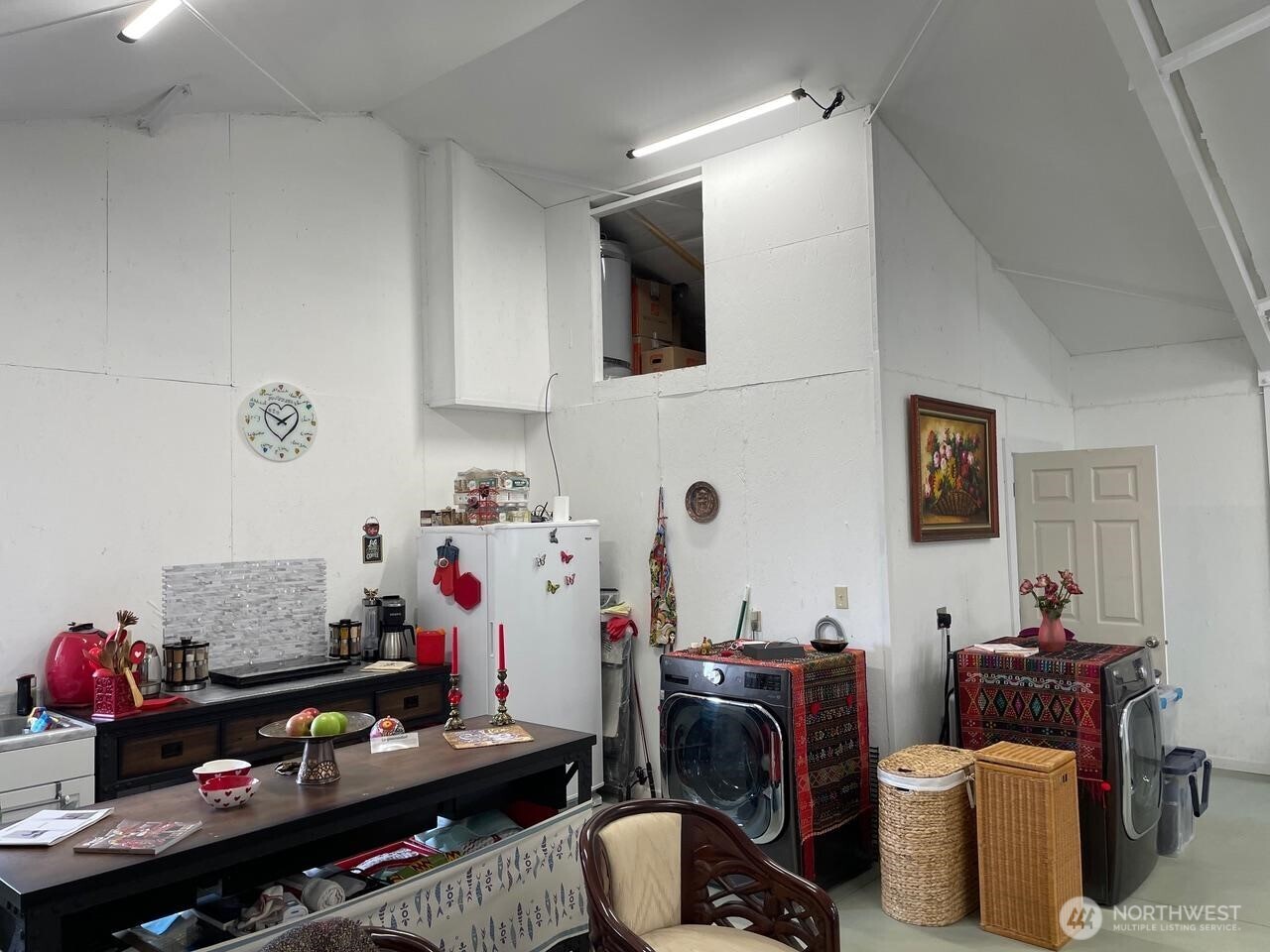 136 Eastlake Road Oroville, WA 98844 - Photo 14 of 20 a room with furniture a flat screen tv and a window