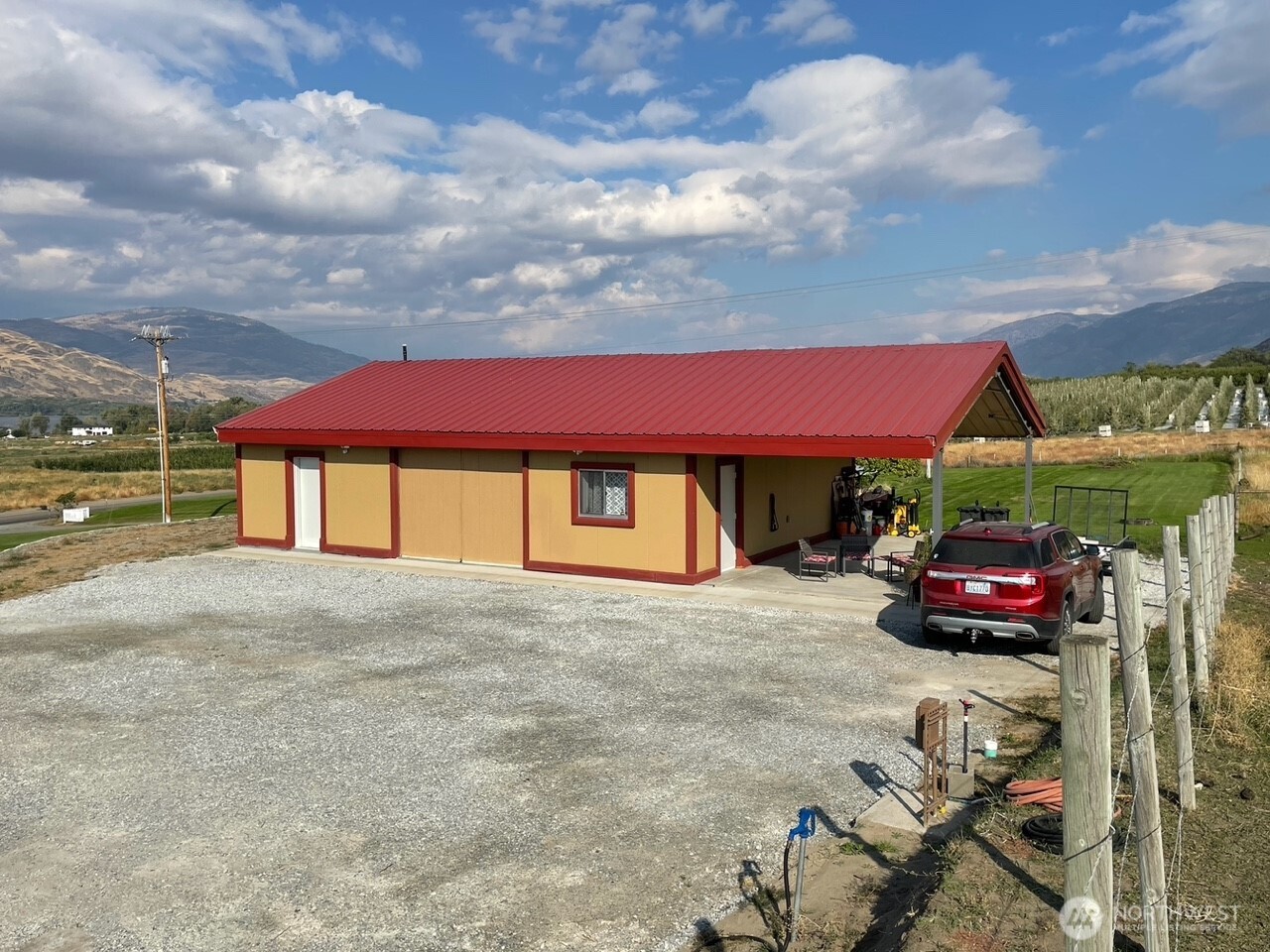 136 Eastlake Road Oroville, WA 98844 - Photo 7 of 20 a view of a house with a yard