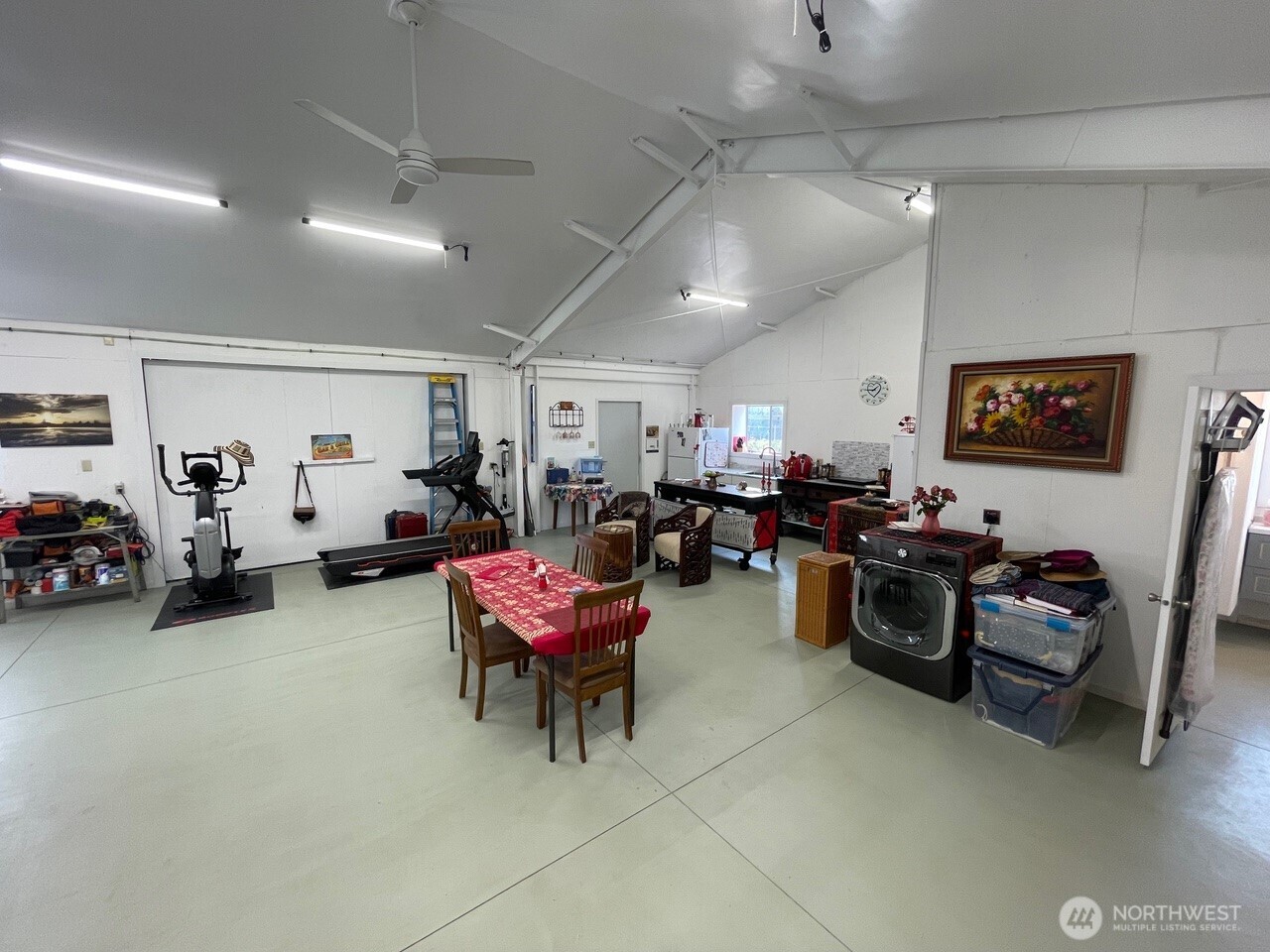 136 Eastlake Road Oroville, WA 98844 - Photo 10 of 20 a living room with lots of furniture and a flat screen tv