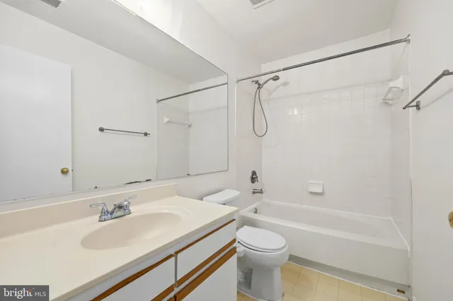 a bathroom with a sink a toilet and a bathtub