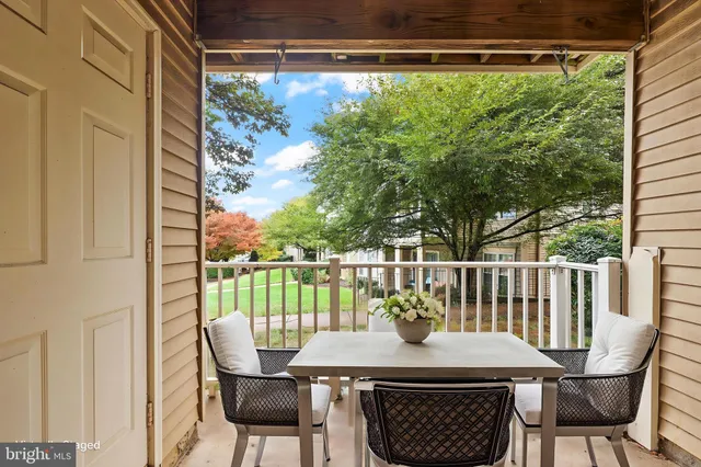 a view of balcony with furniture and garden