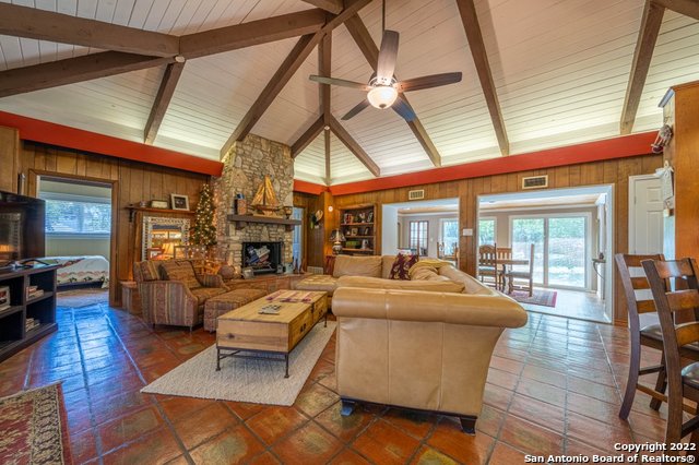654 Hillcrest Forest Canyon Lake, TX 78133 - Photo 1 of 1 a living room with fireplace furniture and a rug