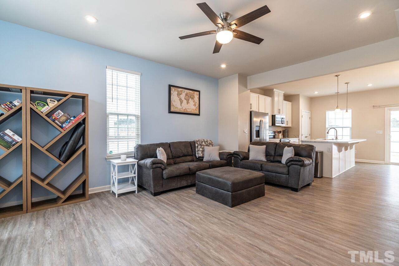 8701 Red Canyon Way Raleigh, NC 27616 - Photo 11 of 28 a living room with furniture and a ceiling fan