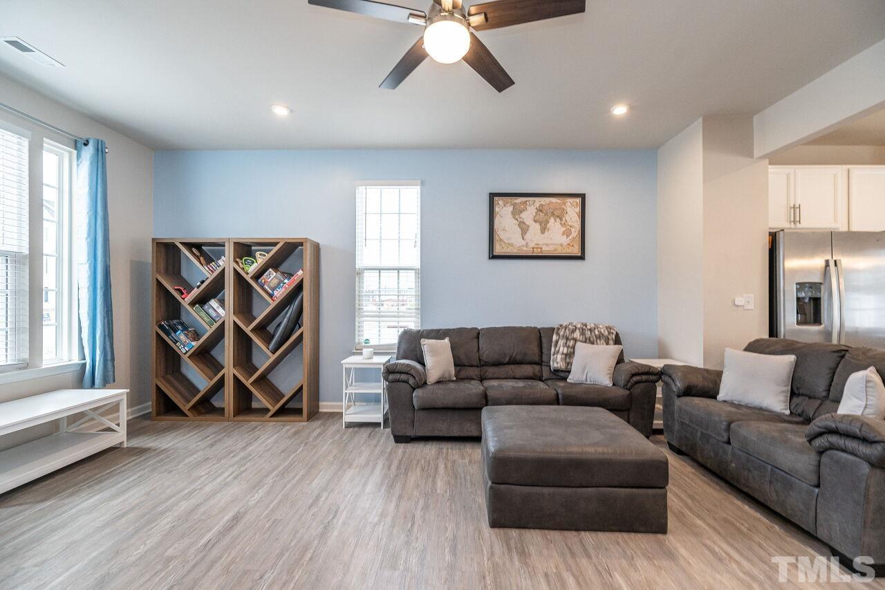 8701 Red Canyon Way Raleigh, NC 27616 - Photo 12 of 28 a living room with furniture and wooden floor