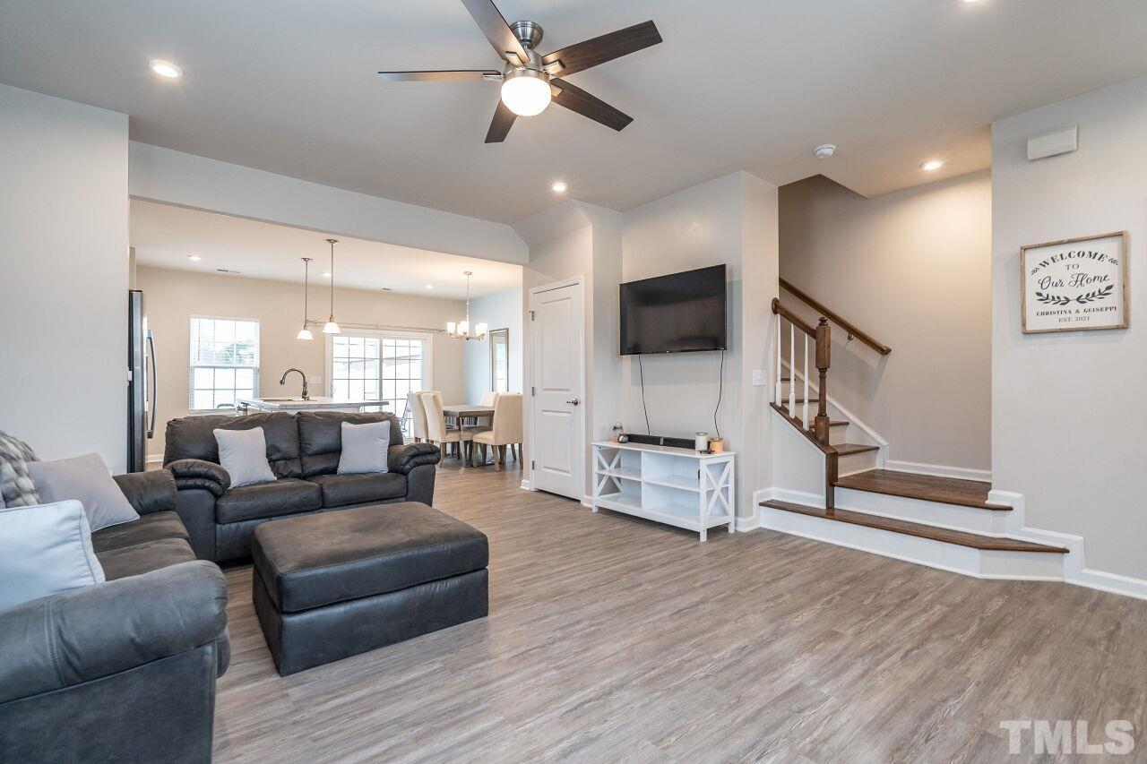8701 Red Canyon Way Raleigh, NC 27616 - Photo 15 of 28 a living room with furniture and a wooden floor