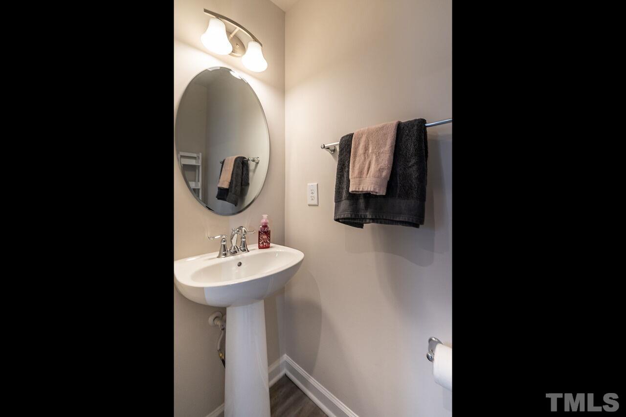 8701 Red Canyon Way Raleigh, NC 27616 - Photo 23 of 28 a bathroom with a sink and a mirror