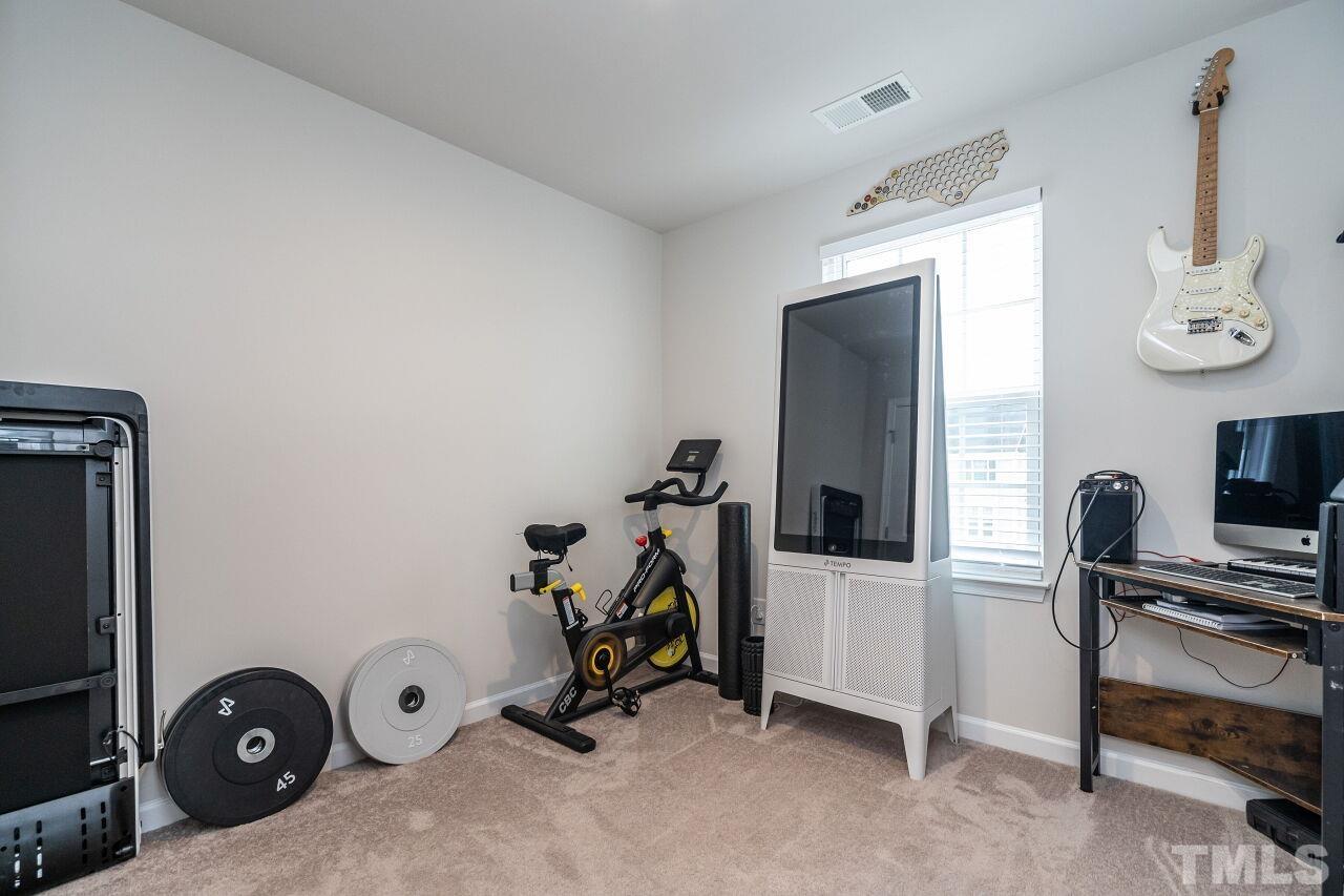 8701 Red Canyon Way Raleigh, NC 27616 - Photo 27 of 28 a view of a workspace with furniture and a window