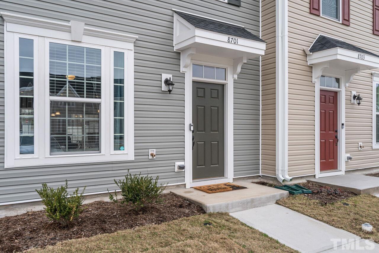 8701 Red Canyon Way Raleigh, NC 27616 - Photo 9 of 28 a front view of a house with garden