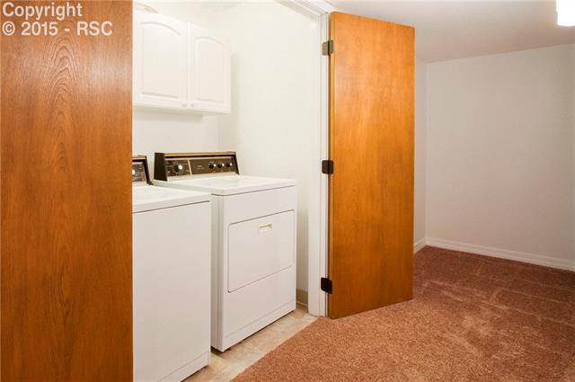 7808 Swiftrun Road Colorado Springs, CO 80920 - Photo 30 of 33 Laundry Room with Cabinets located in Basement