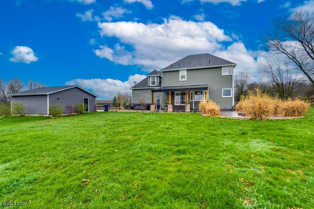 4121 New Milford Road Rootstown, OH 44272 - Photo 7 of 50 Back of house with a patio and a lawn