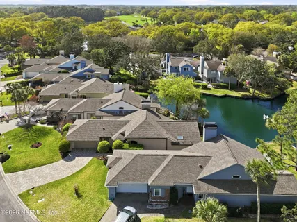 an aerial view of a house with a garden