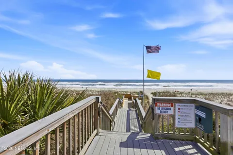 a view of a balcony with an ocean