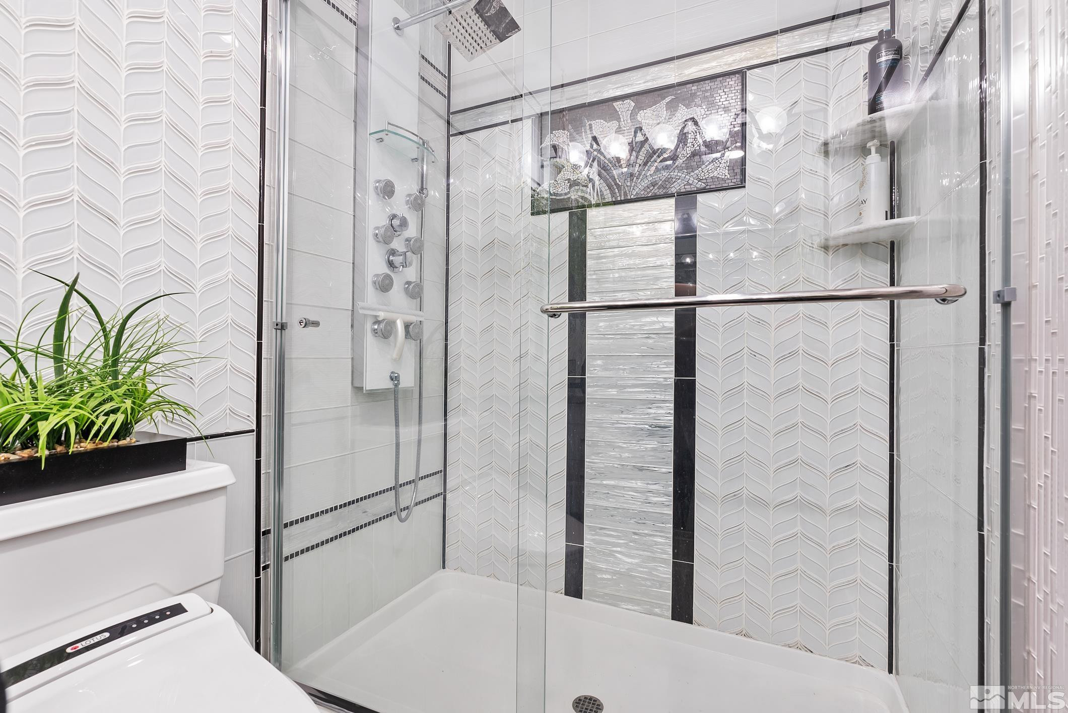 100 North Arlington Avenue, Unit 23N Reno, NV 89501 - Photo 12 of 17 a bathroom with a bathtub and shower