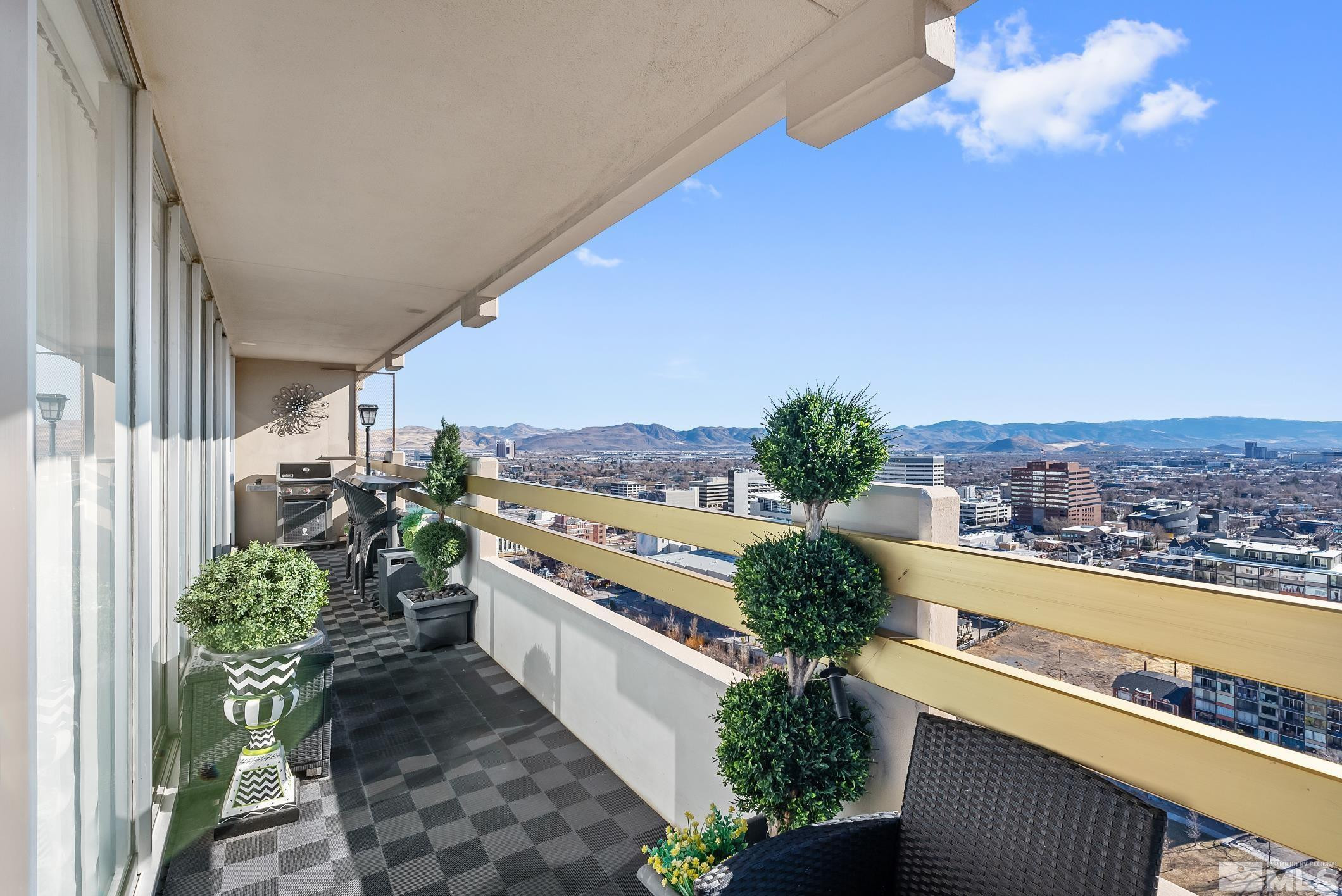 100 North Arlington Avenue, Unit 23N Reno, NV 89501 - Photo 17 of 17 a view of a city from a balcony with an outdoor seating