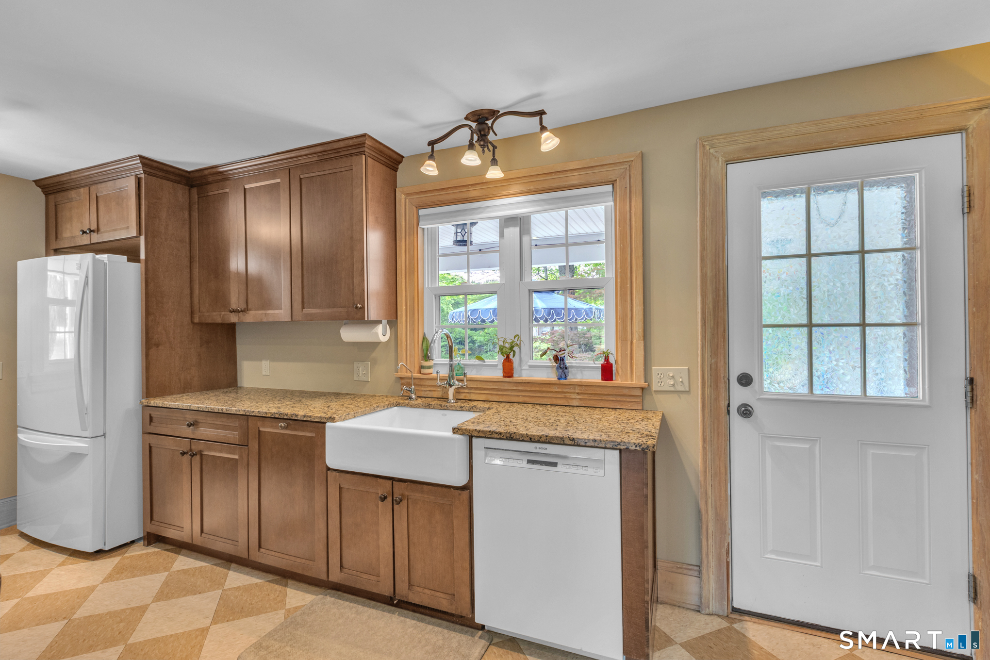 808 Branch Road Suffield, CT 06078 - Photo 9 of 40 a kitchen that has a lot of cabinets in it and a window