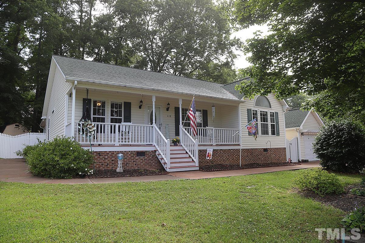112 Dullis Circle Garner, NC 27529 - Photo 1 of 23 a front view of house with a garden