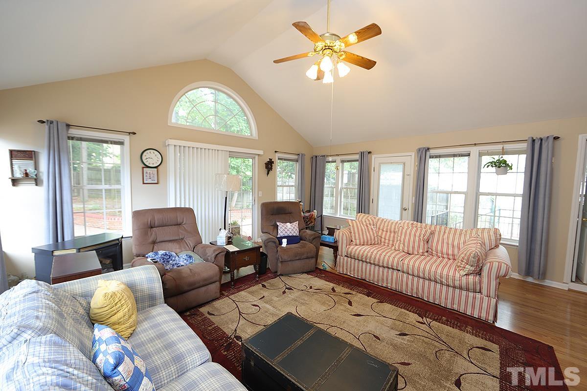 112 Dullis Circle Garner, NC 27529 - Photo 11 of 23 a living room with furniture fireplace and a large window