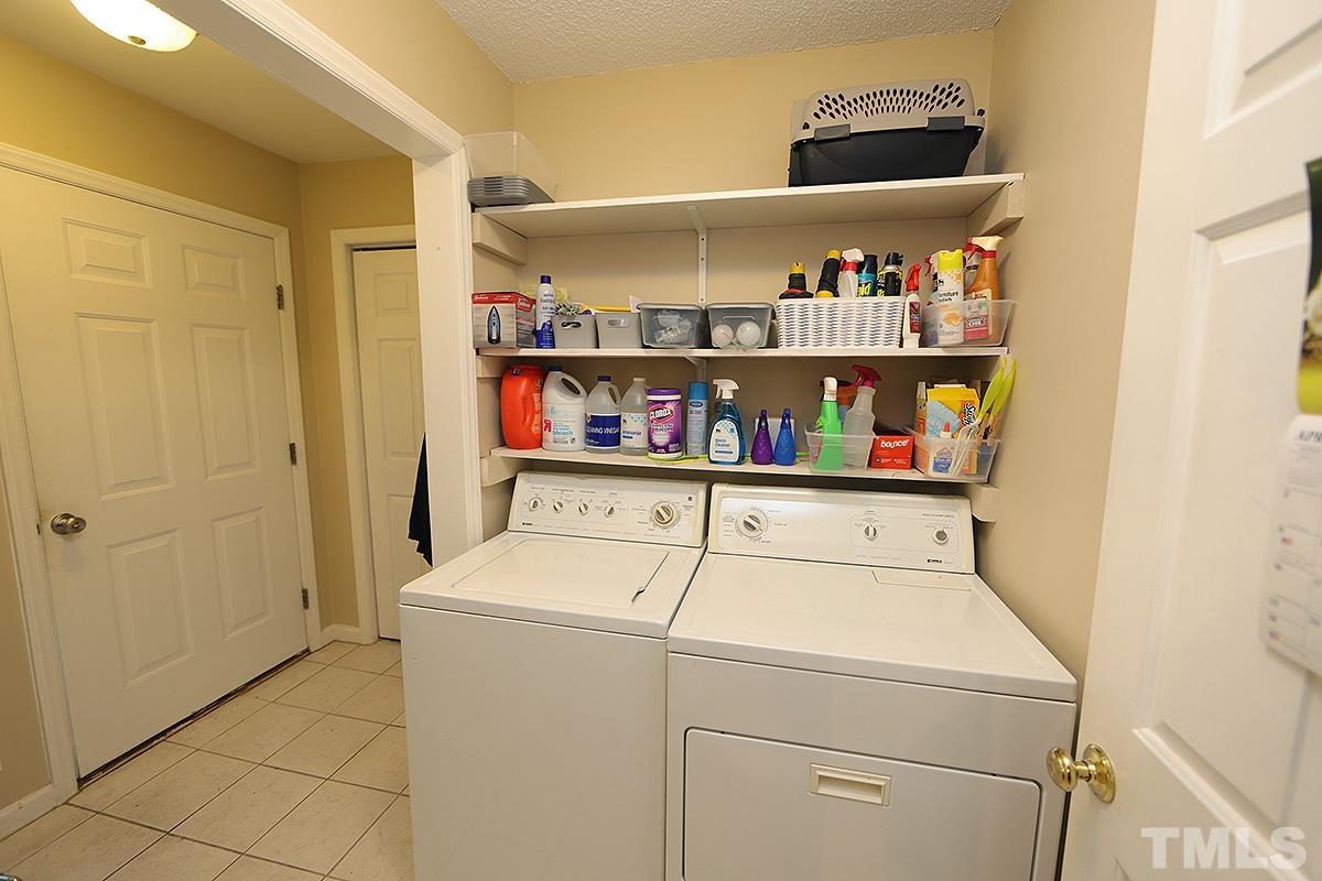 112 Dullis Circle Garner, NC 27529 - Photo 13 of 23 a utility room with dryer and washer