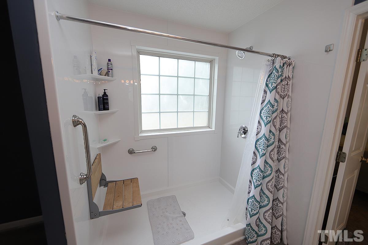 112 Dullis Circle Garner, NC 27529 - Photo 16 of 23 a bathroom with a bathtub and shower