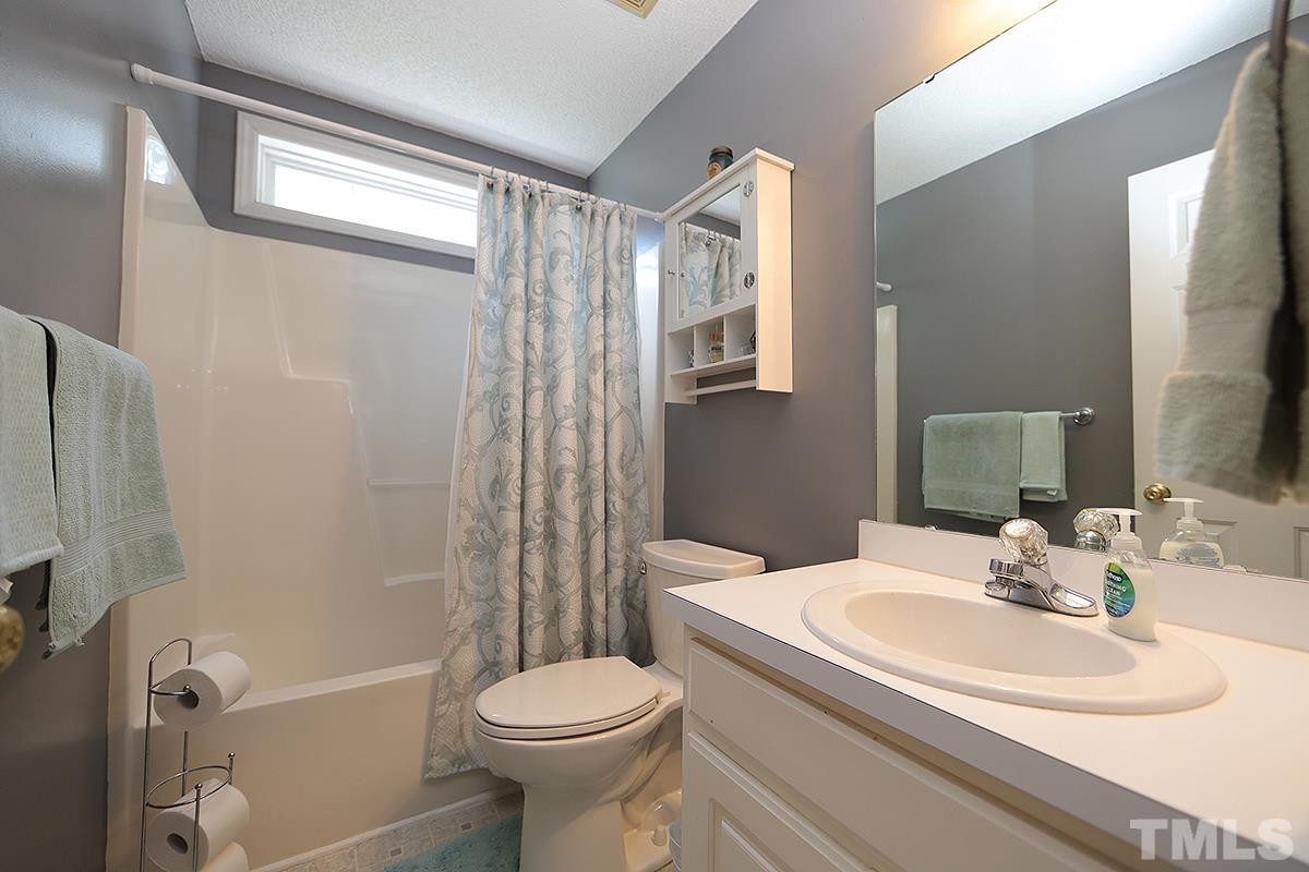 112 Dullis Circle Garner, NC 27529 - Photo 18 of 23 a bathroom with a sink toilet and shower