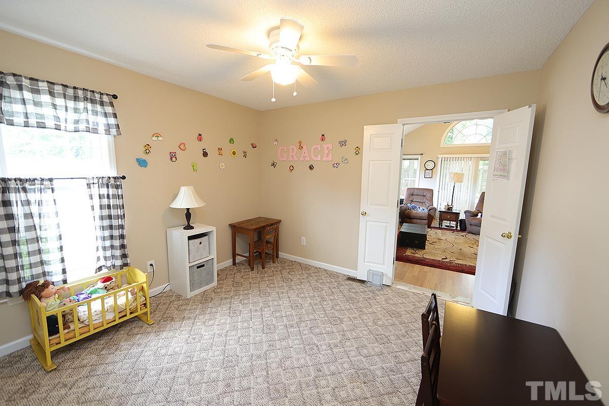 112 Dullis Circle Garner, NC 27529 - Photo 19 of 23 a living room with furniture and a table