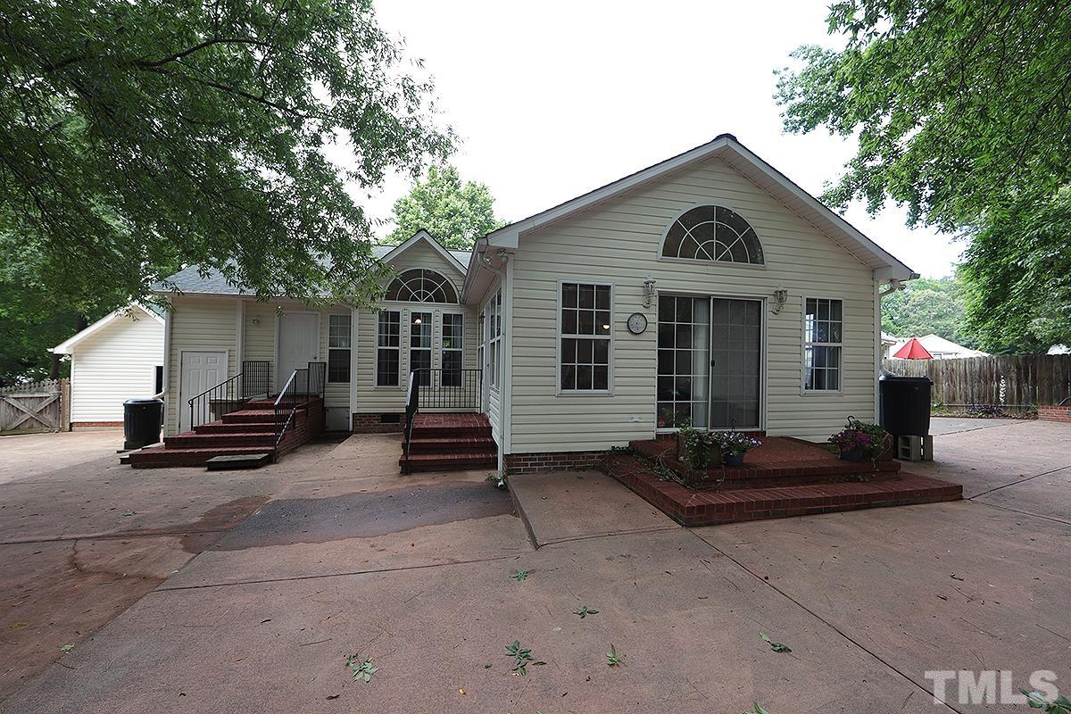 112 Dullis Circle Garner, NC 27529 - Photo 20 of 23 a front view of a house with a patio