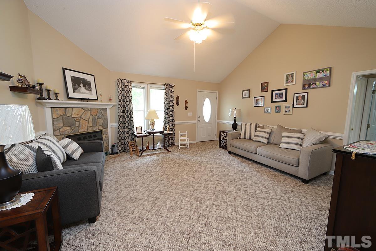 112 Dullis Circle Garner, NC 27529 - Photo 6 of 23 a living room with furniture and a fireplace