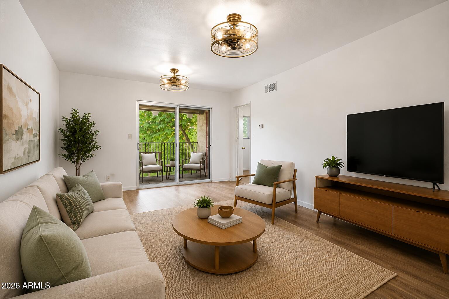 5525 East Thomas Road, Unit R13 Phoenix, AZ 85018 - Photo 2 of 30 living room and patio for condo