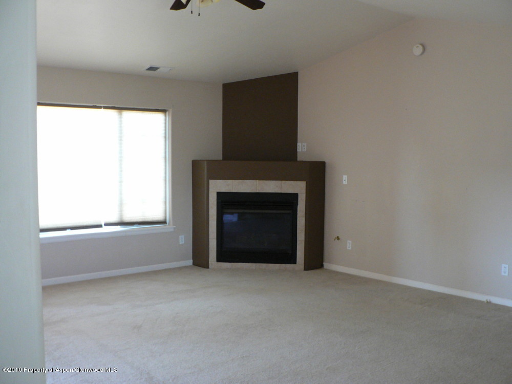 779 West 26th Street Rifle, CO 81650 - Photo 8 of 26 living room closer view of fp