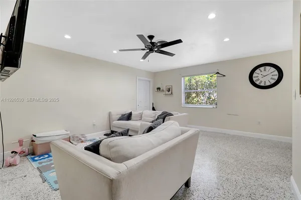 a living room with furniture and a window