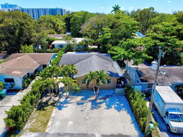 an aerial view of a house with a garden