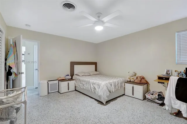 a bedroom with a bed and a view of bedroom