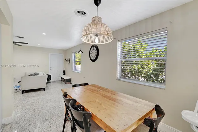 a view of a dining room with furniture window and chandelier