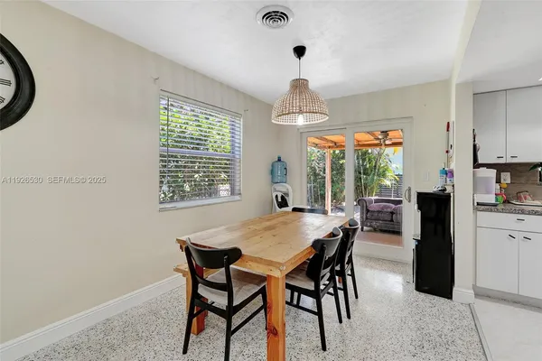 a view of a dining room with furniture window and outside view
