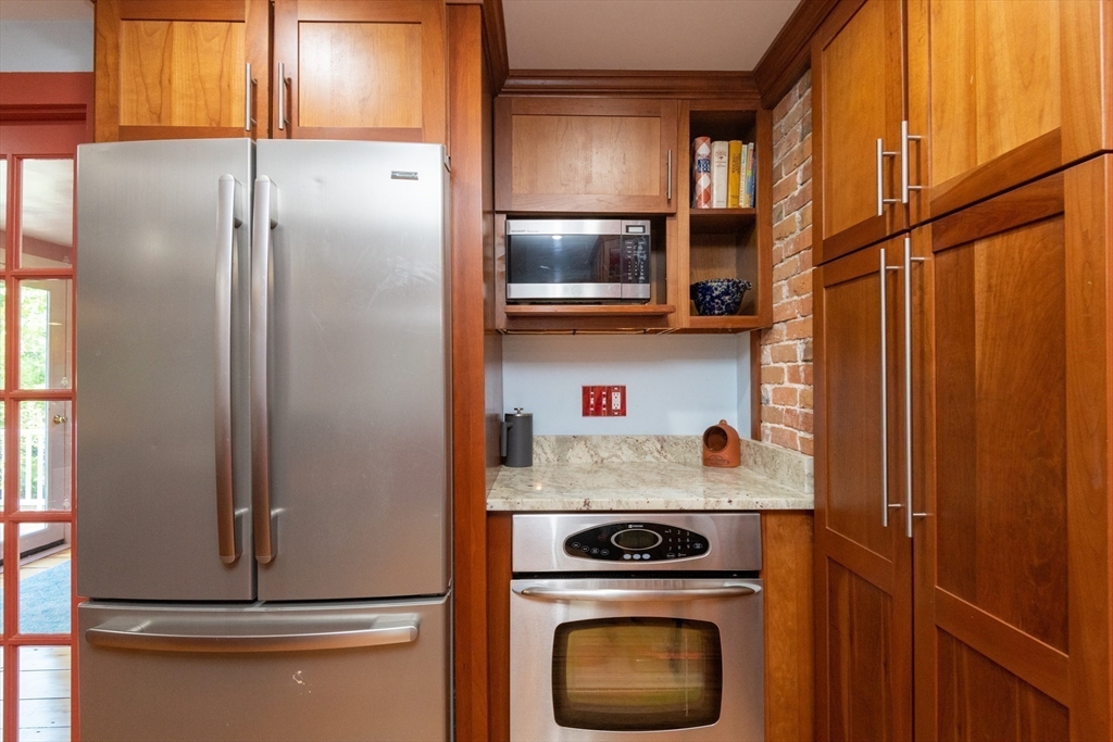 304 North Street Georgetown, MA 01833 - Photo 15 of 42 a kitchen with a refrigerator and a stove