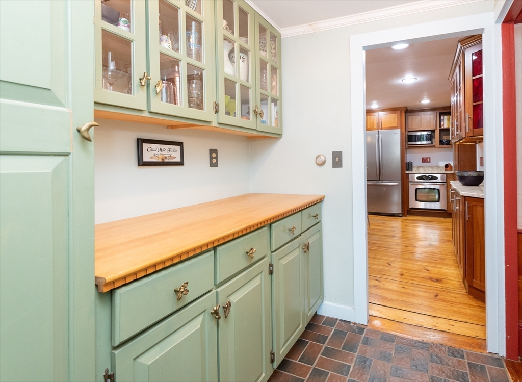 304 North Street Georgetown, MA 01833 - Photo 19 of 42 a view of a kitchen with furniture and an entrance