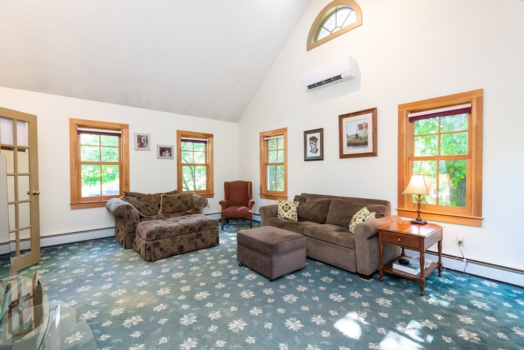 304 North Street Georgetown, MA 01833 - Photo 20 of 42 a living room with furniture and a window