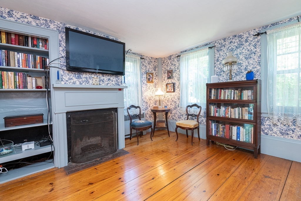 304 North Street Georgetown, MA 01833 - Photo 23 of 42 a living room with furniture and a fireplace