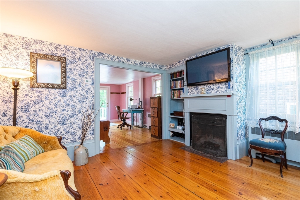 304 North Street Georgetown, MA 01833 - Photo 24 of 42 a living room with furniture and a fireplace