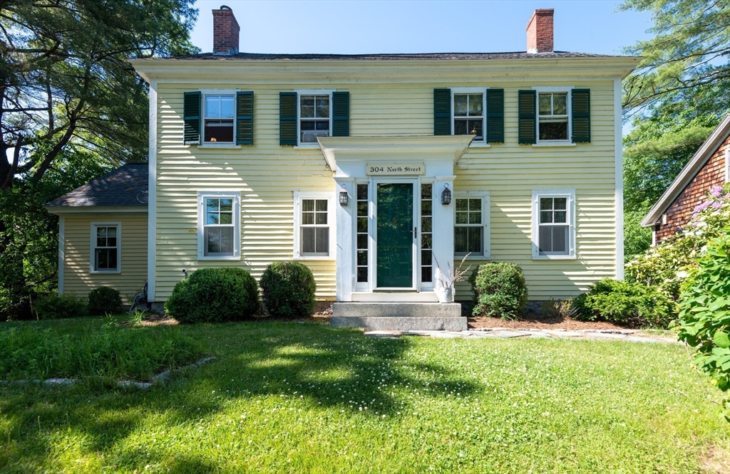 304 North Street Georgetown, MA 01833 - Photo 3 of 42 a view of a house with a yard and plants